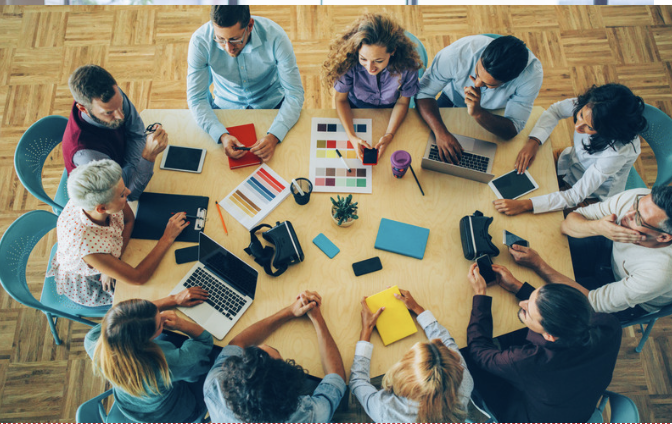 A diverse group collaborating around a shared table